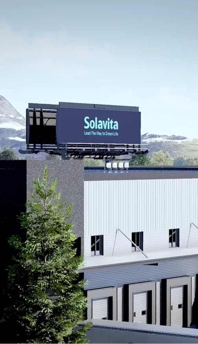 Solavita factory and logistics center with brand billboard, highlighting green energy mission against scenic mountain background